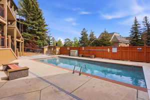 Community pool with a patio area
