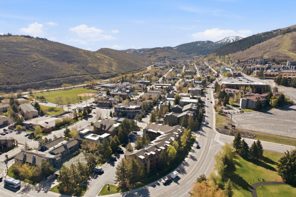 View of property location with mountains and nearby suburban area