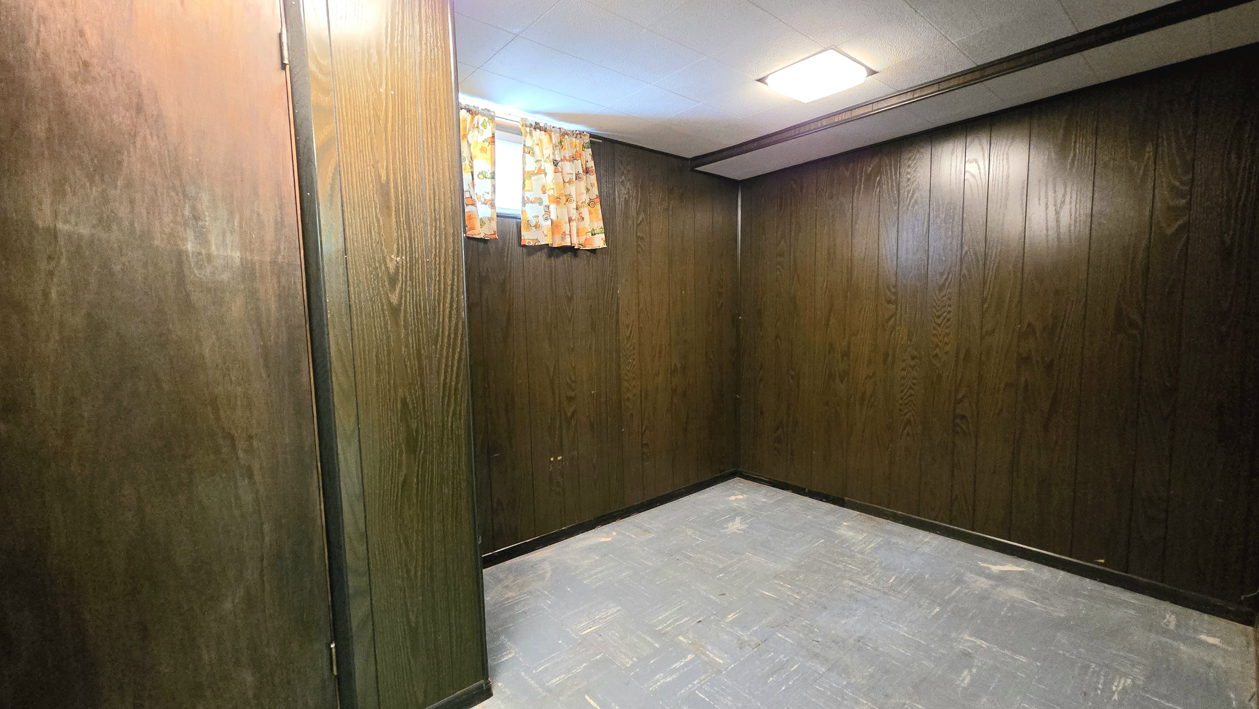 Below grade area featuring light flooring
