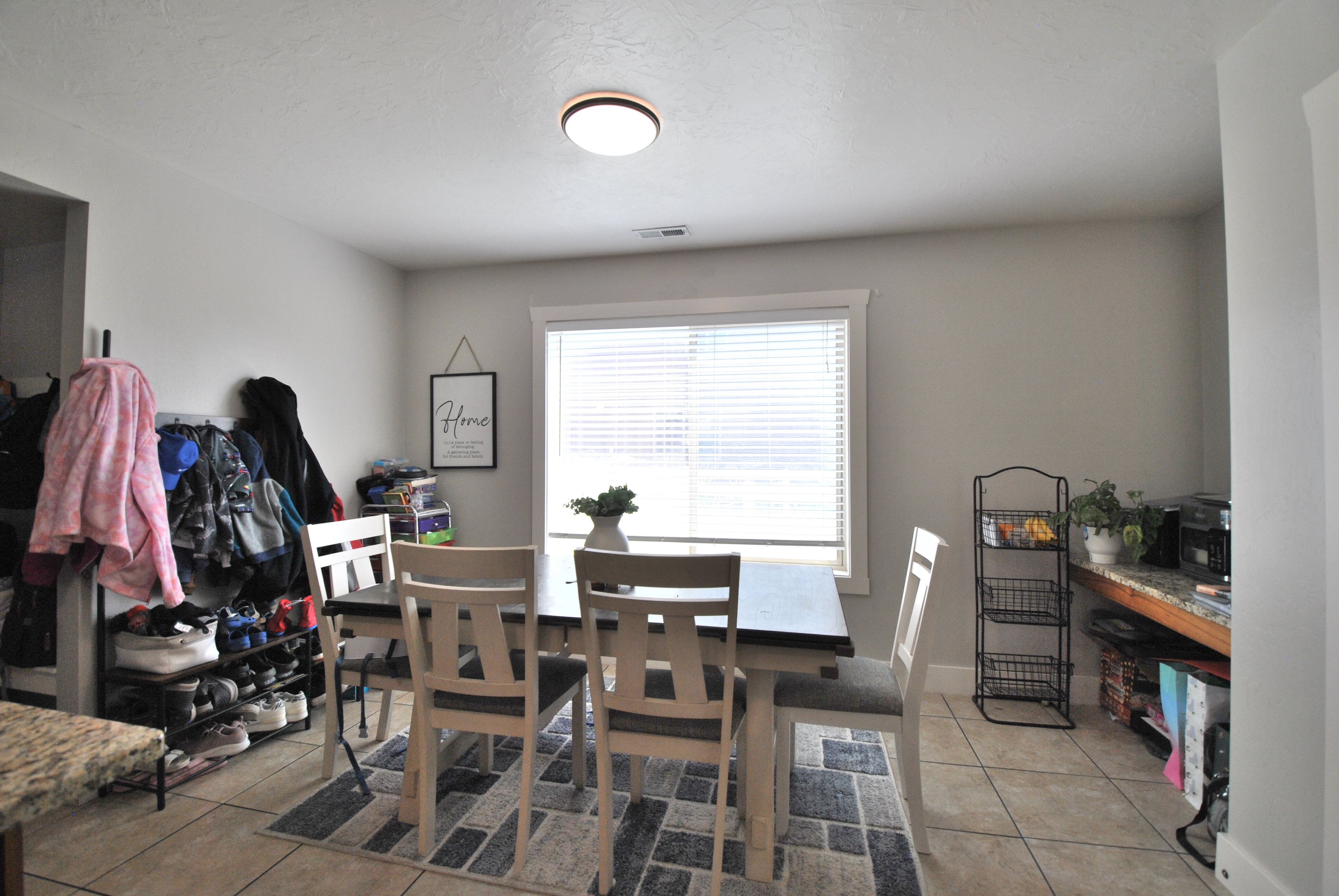 Dining room featuring light tile patterned flooring