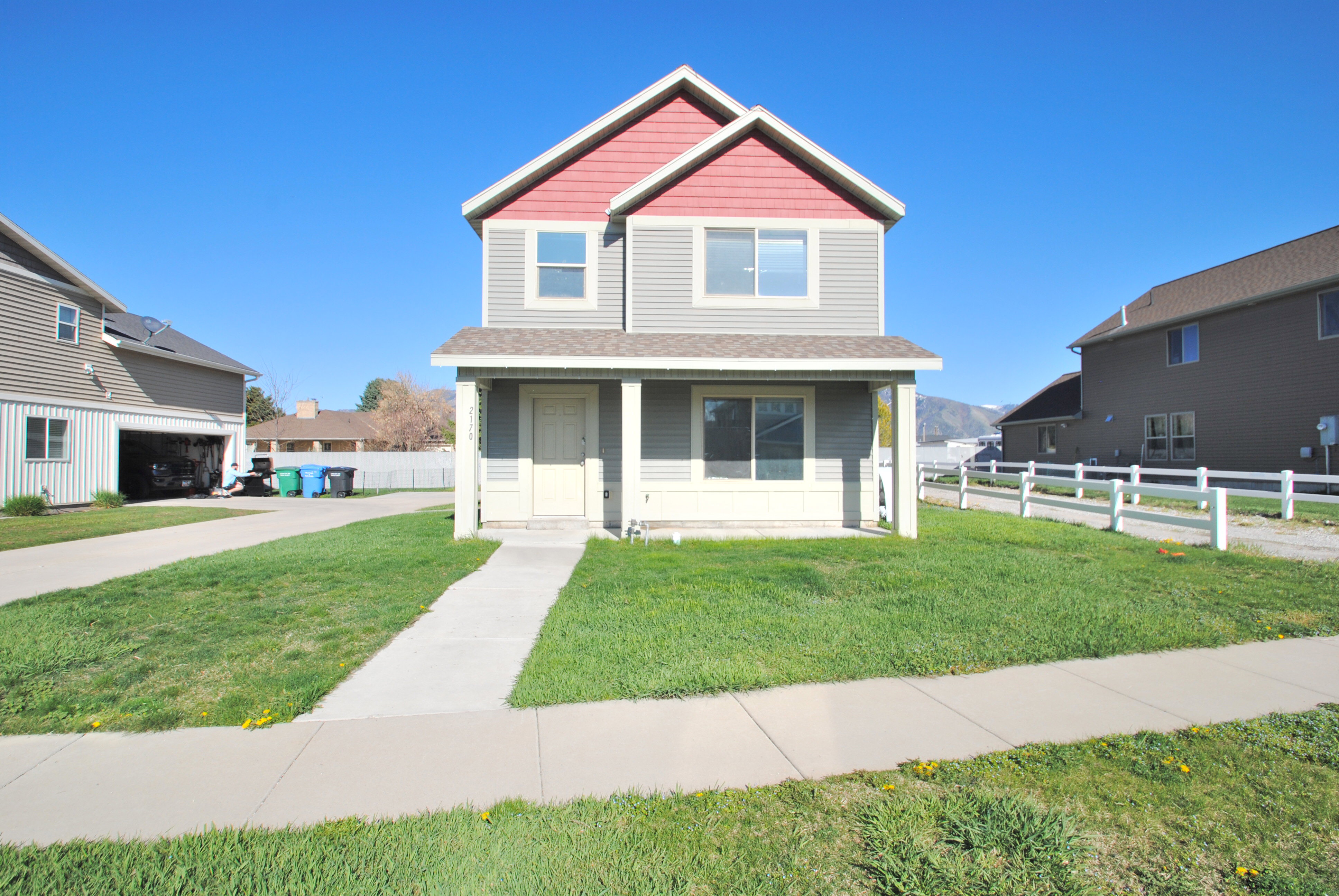 View of front of property featuring a porch and a shingled roof