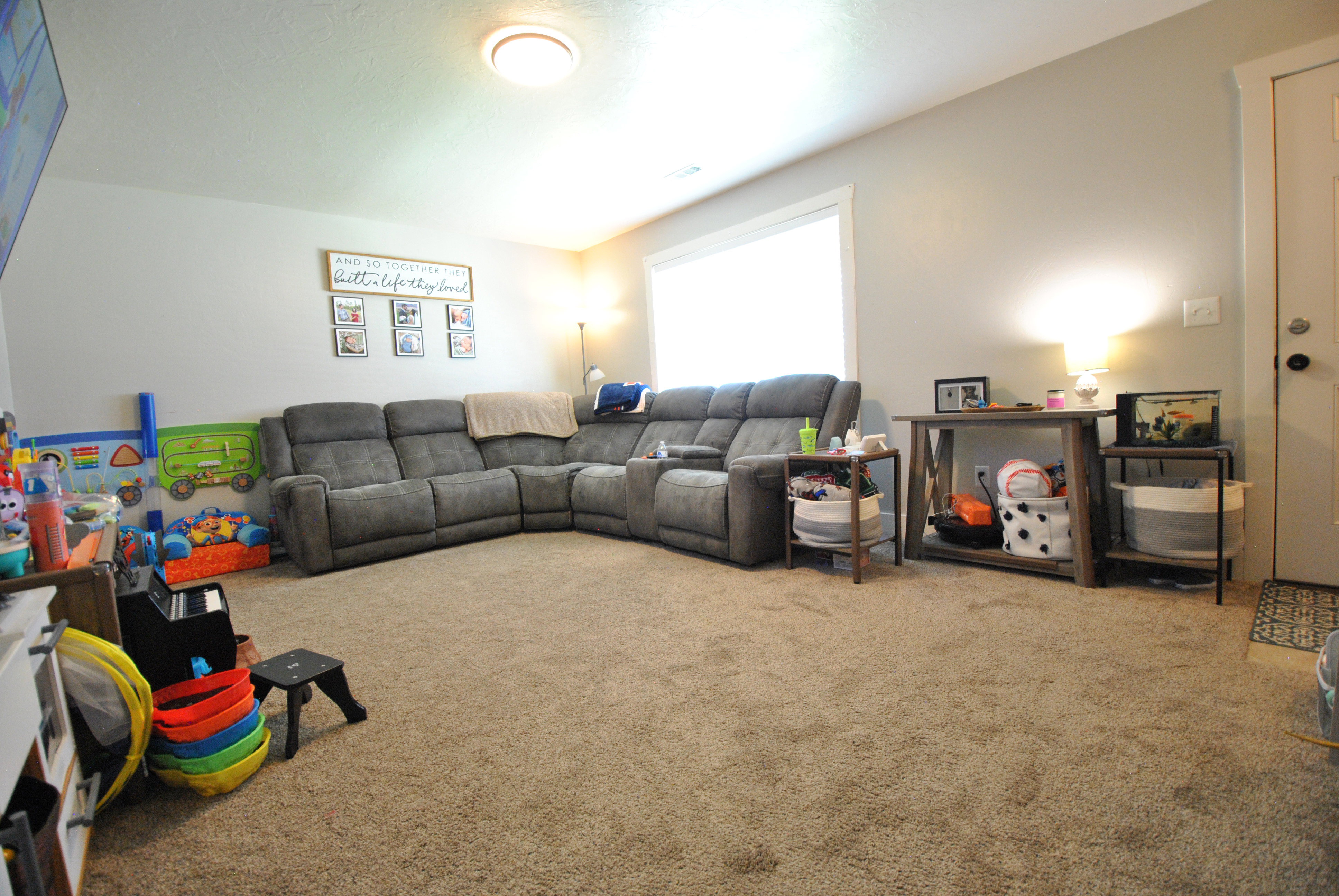 View of carpeted living room.  wall Mounted TV and TV wall Mount Not included.