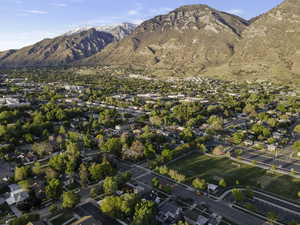 Aerial perspective of suburban area with a mountainous background