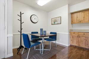 Dining room with dark wood-type flooring
