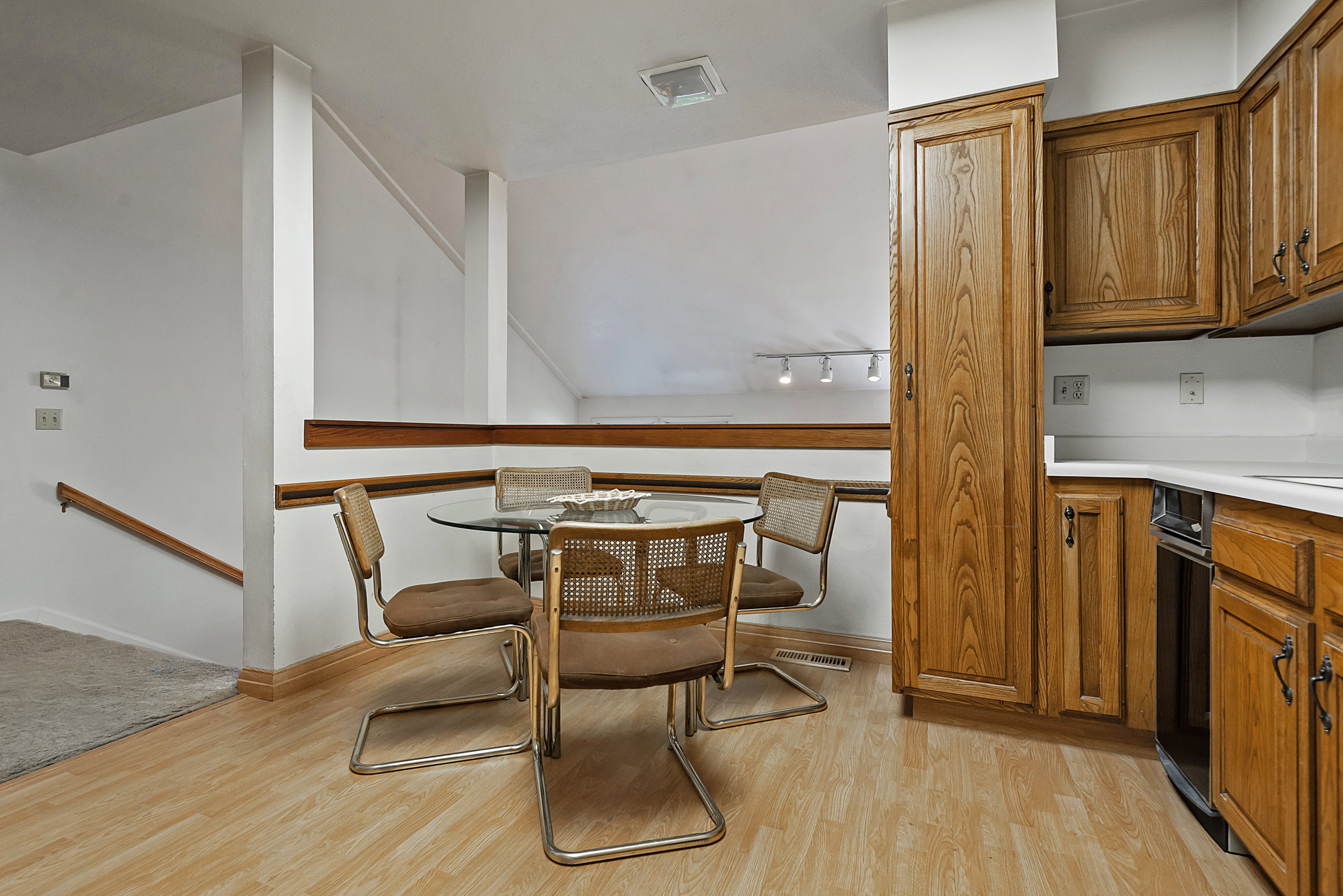 Dining space featuring light wood-style floors and baseboards