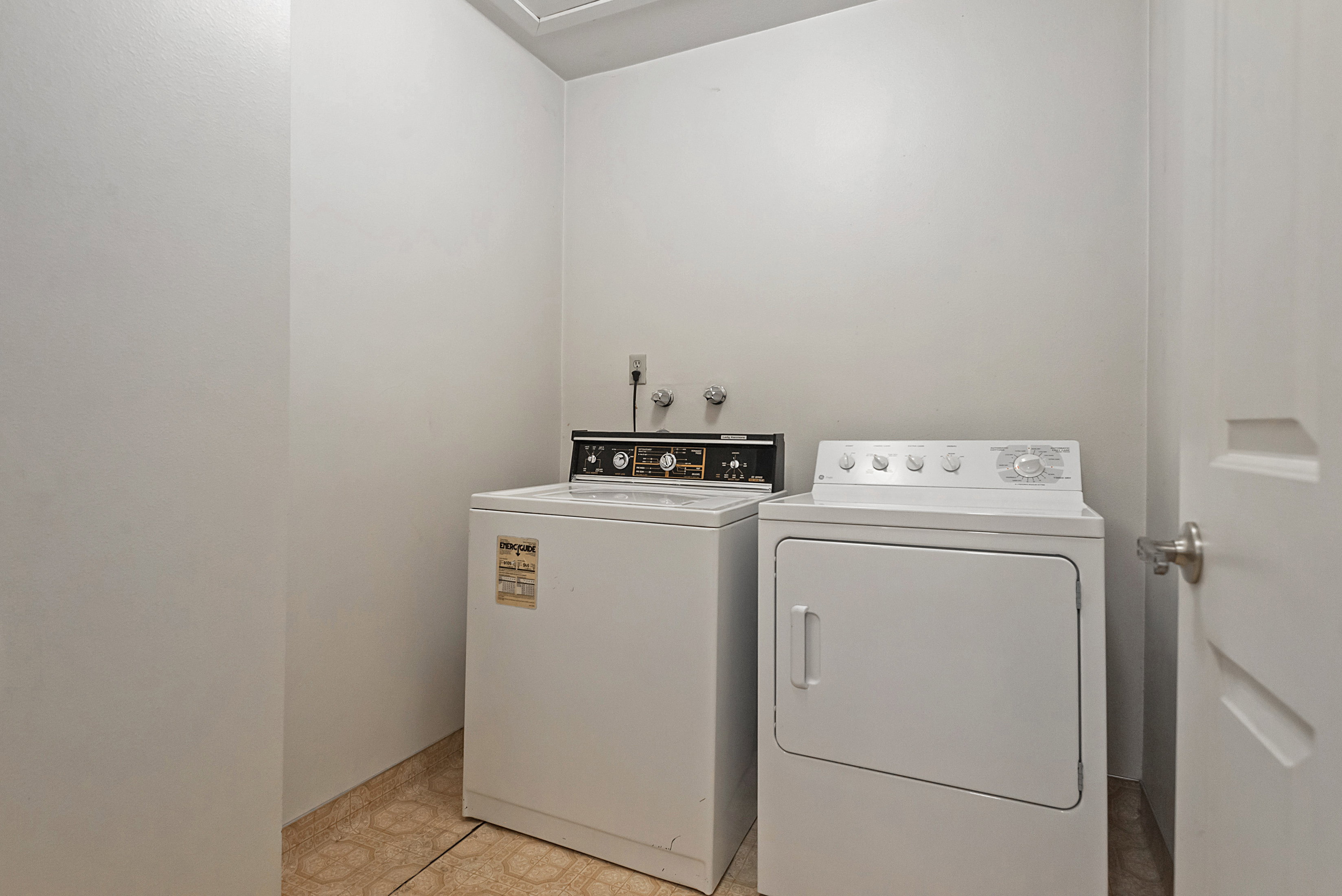 Laundry room featuring independent washer and dryer