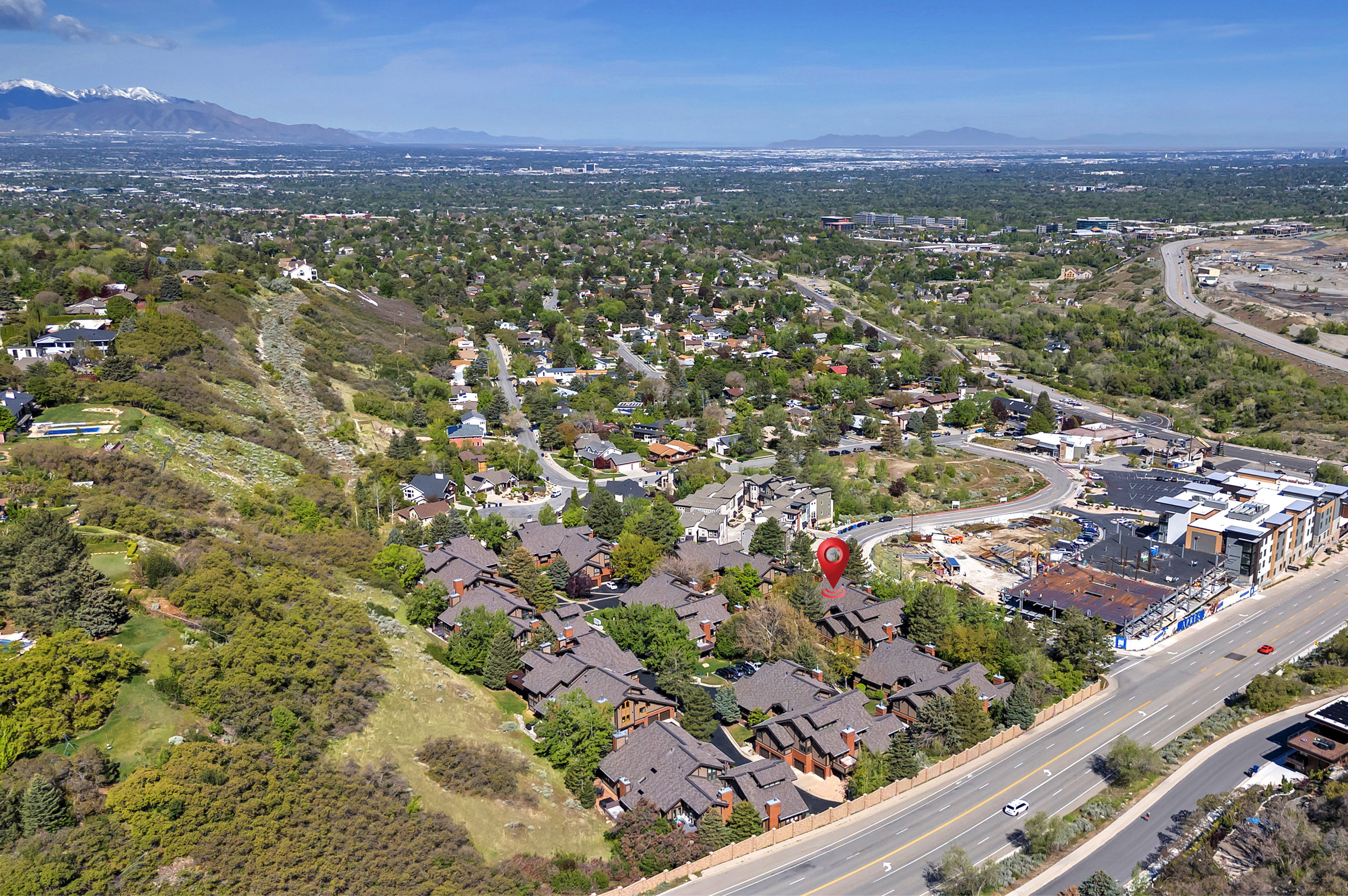 View of property location featuring a mountainous background and nearby suburban area