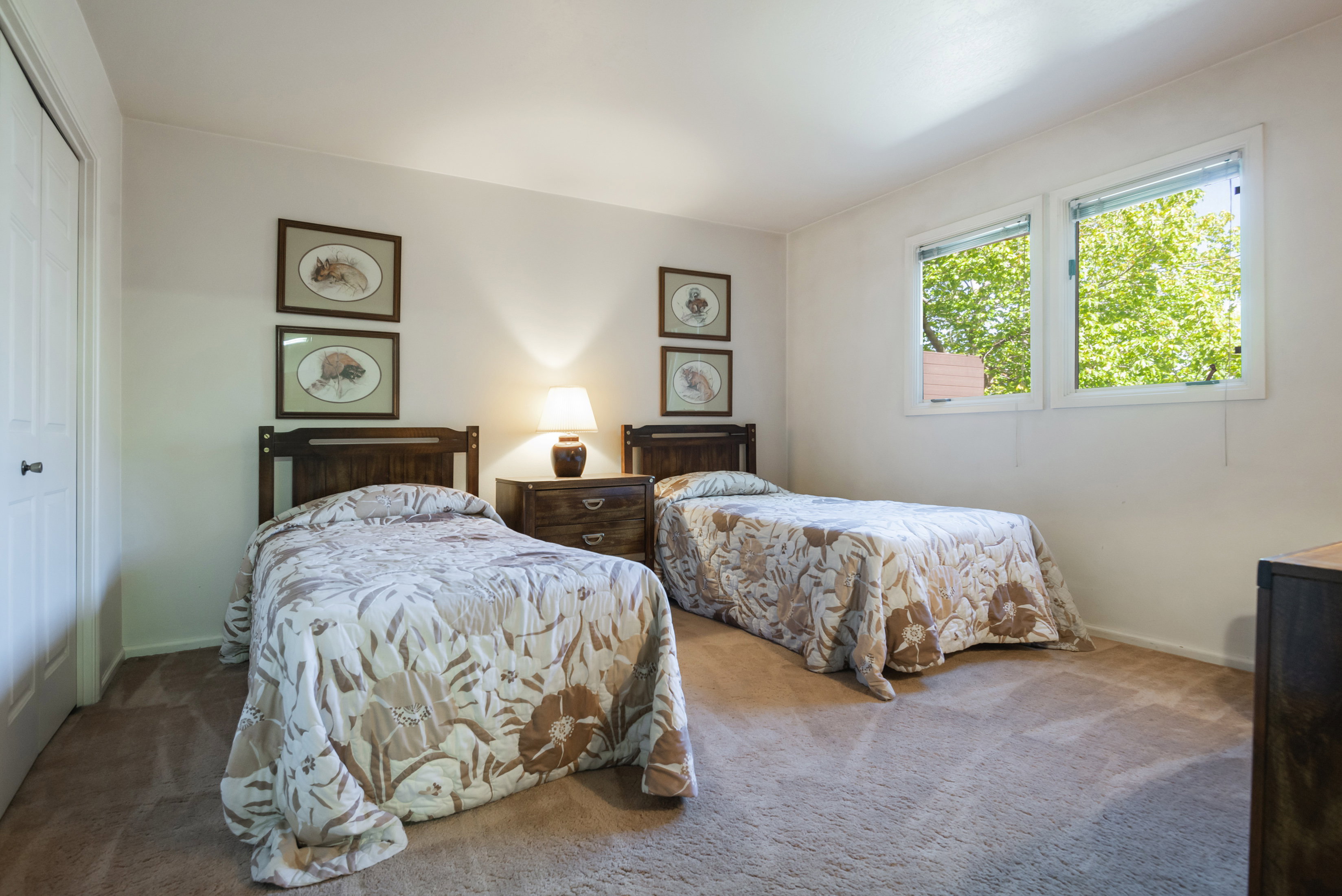 Bedroom featuring a closet and carpet flooring