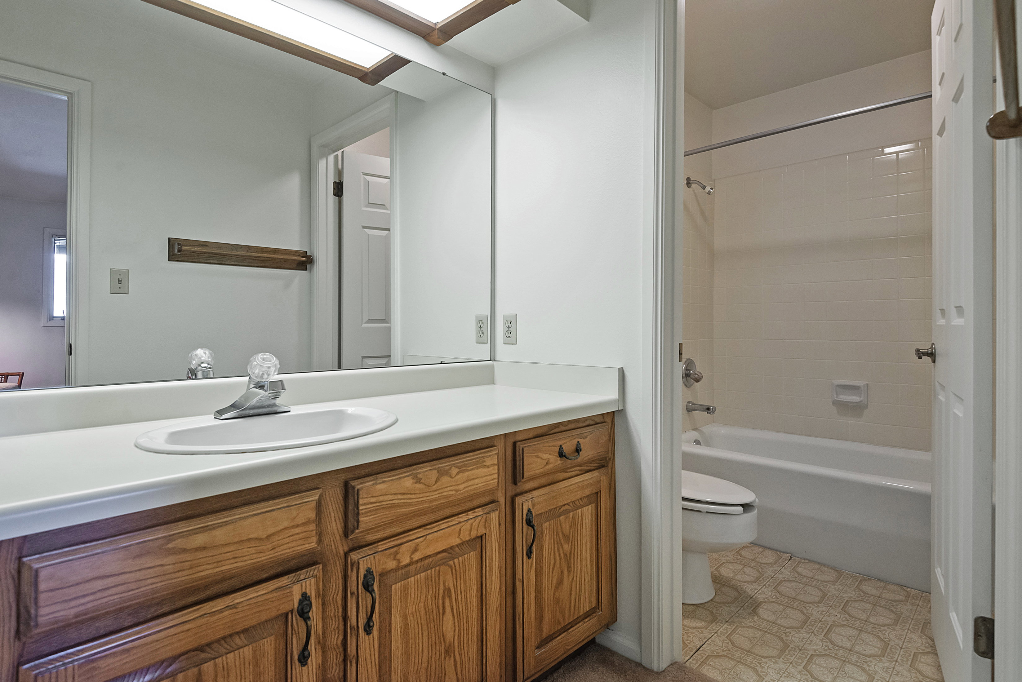 Full bathroom featuring vanity and tub / shower combination