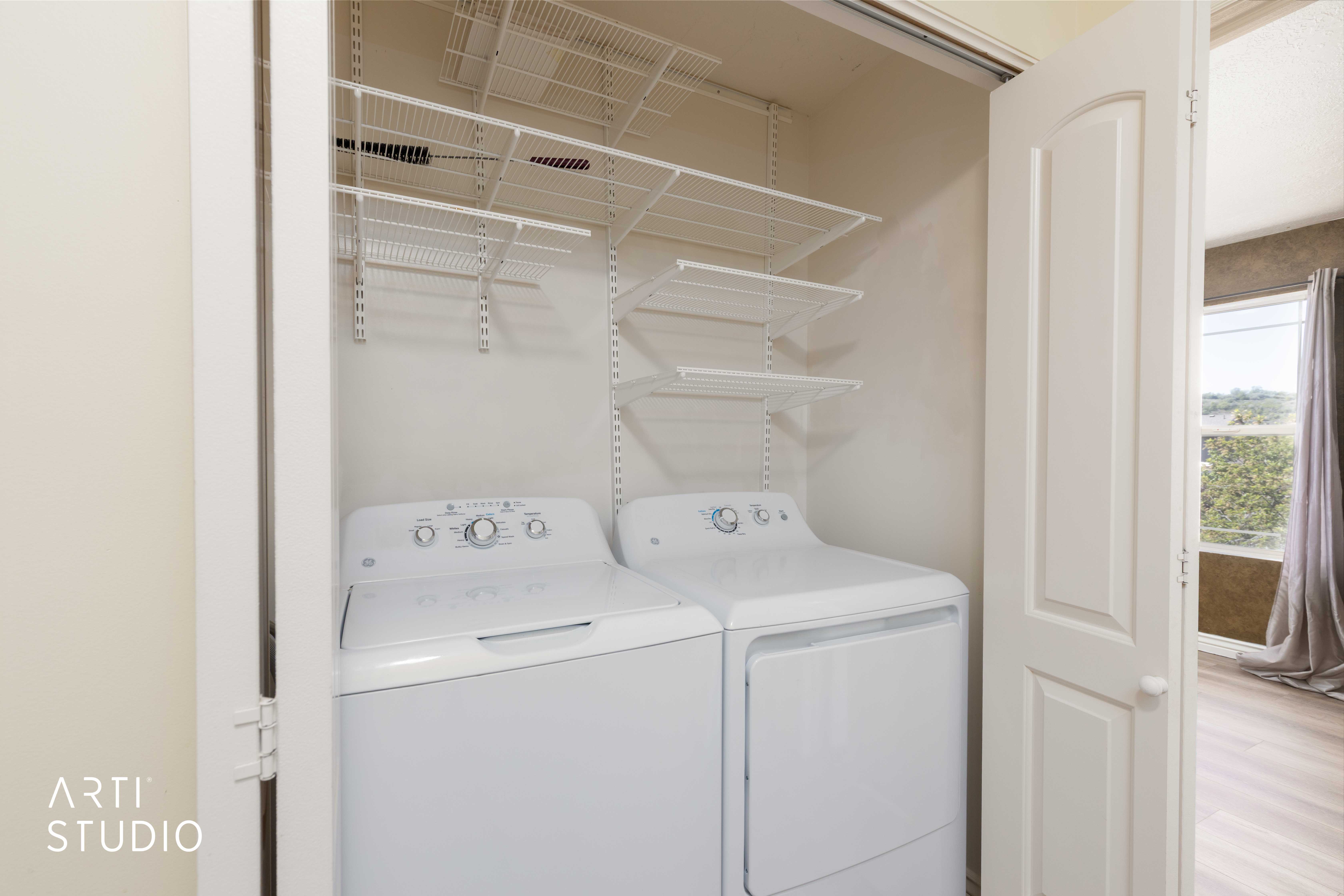 Laundry area featuring separate washer and dryer