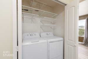 Laundry area featuring separate washer and dryer