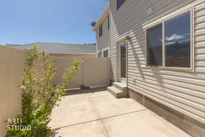 View of property exterior and patio featuring entry steps