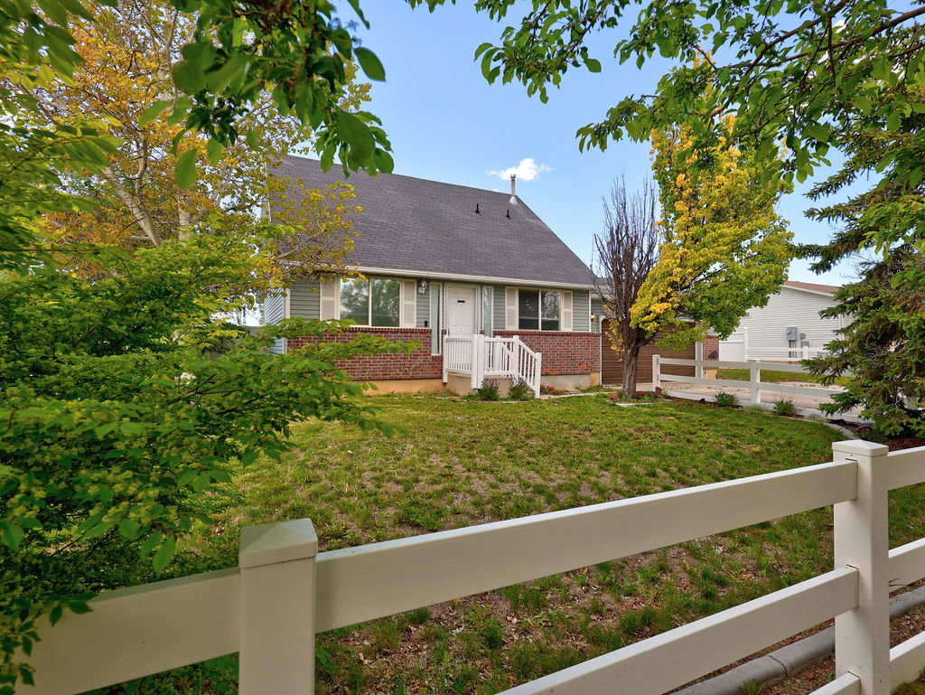 Bungalow-style home with roof with shingles