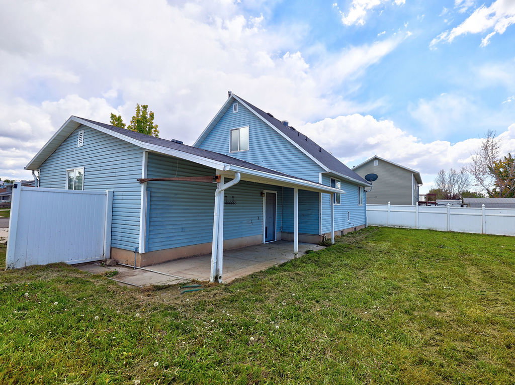 Back of property featuring a patio area