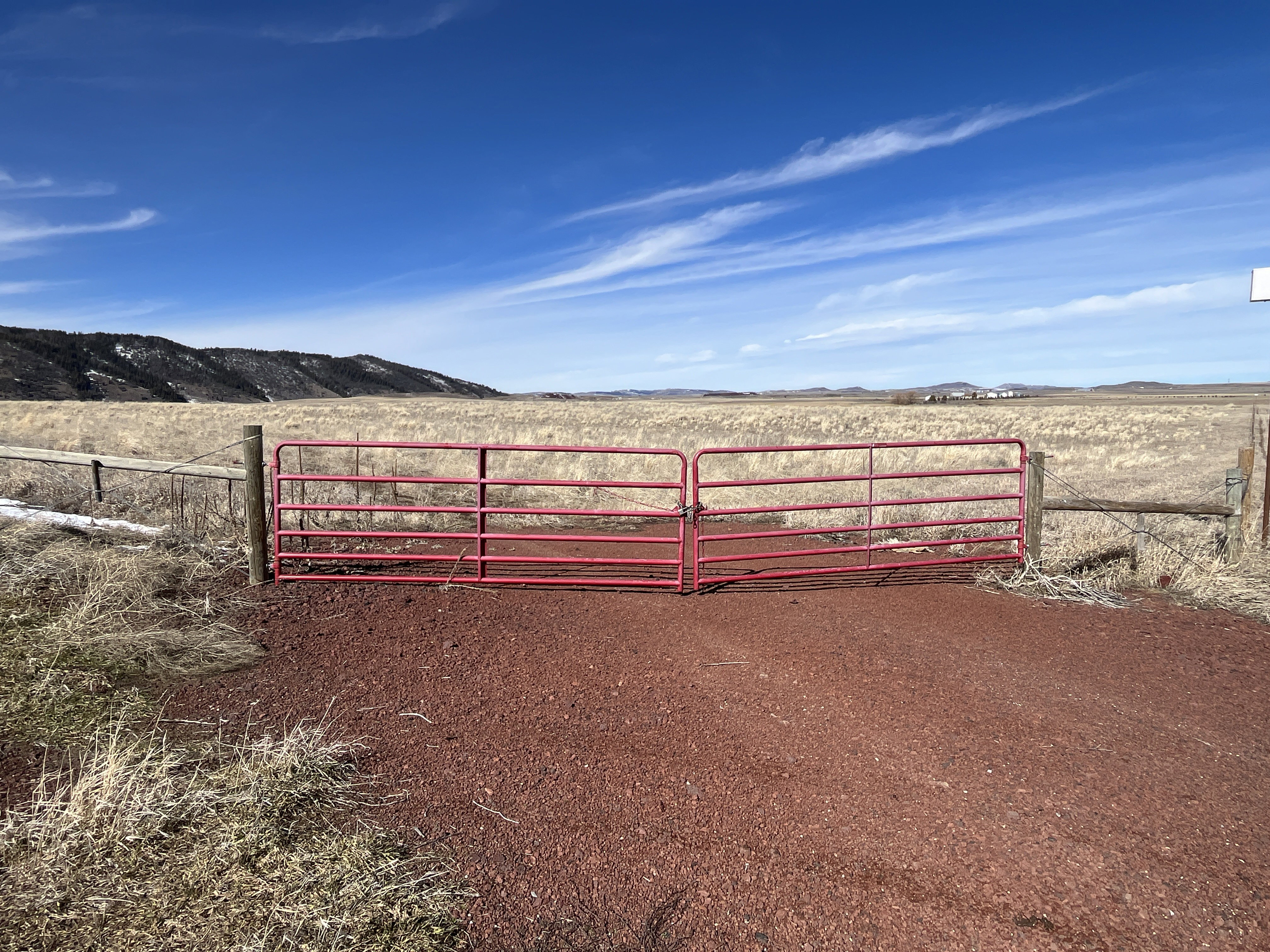 Gate with a mountain view and a view of rural / pastoral area