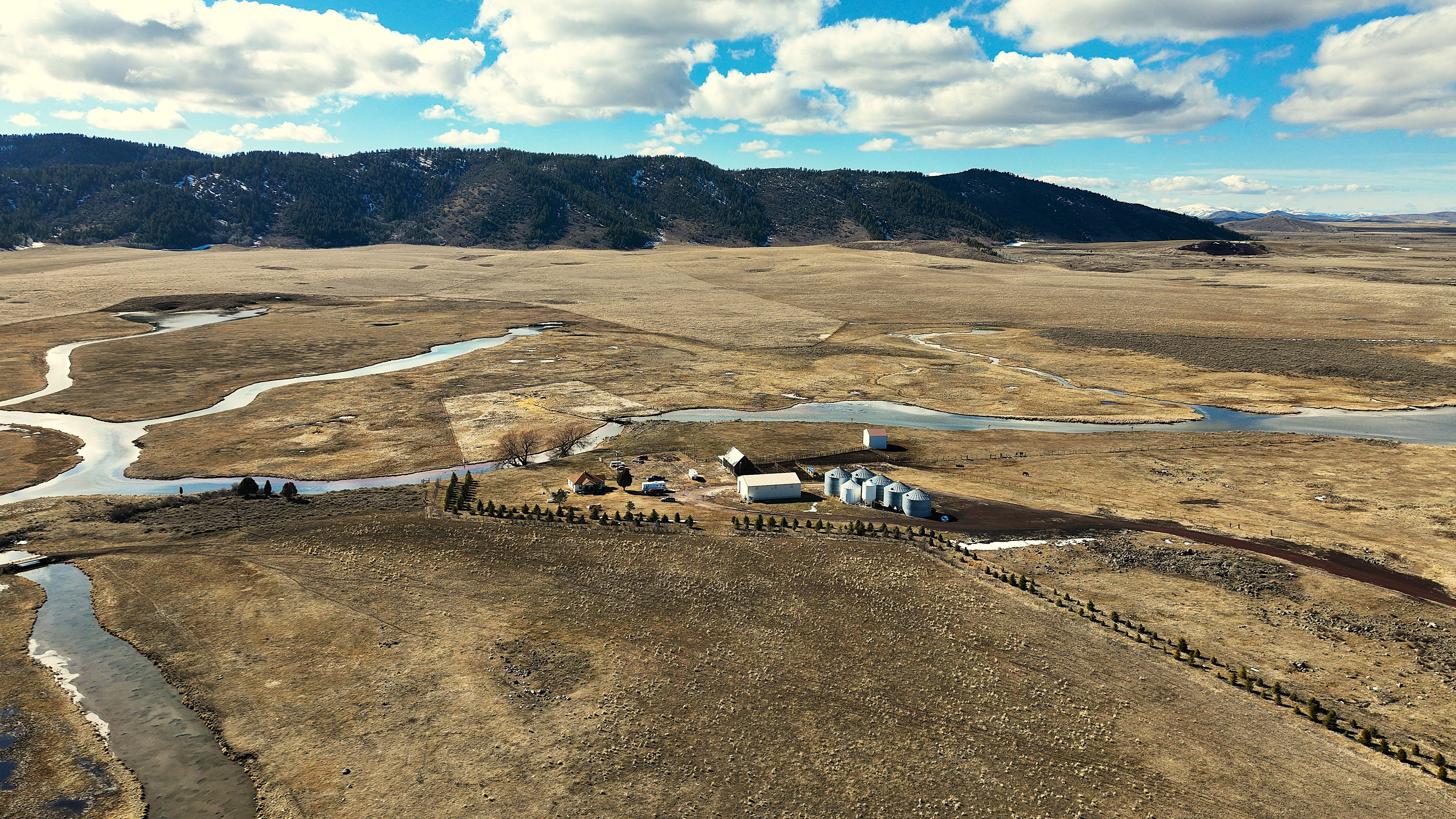 Overview of rural landscape with a mountain backdrop
