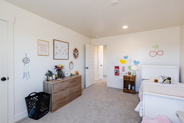 Light-filled interior space with neutral wall paint and plush carpeting