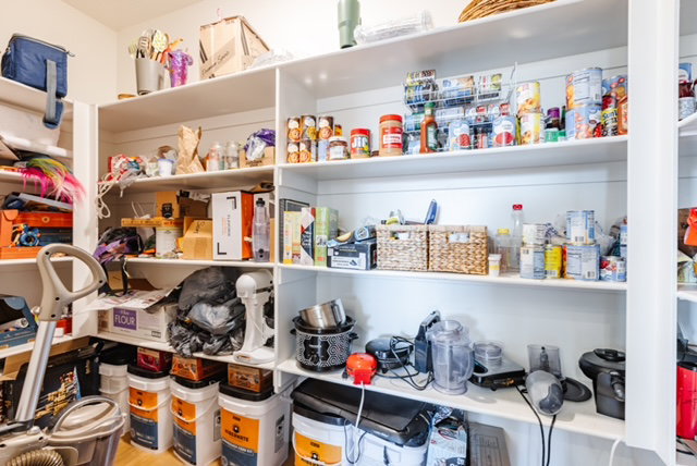 Built-in pantry shelving provides extensive storage capacity