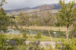 View of mountain backdrop with a nearby body of water