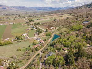 Overview of rural landscape with a water and mountain view