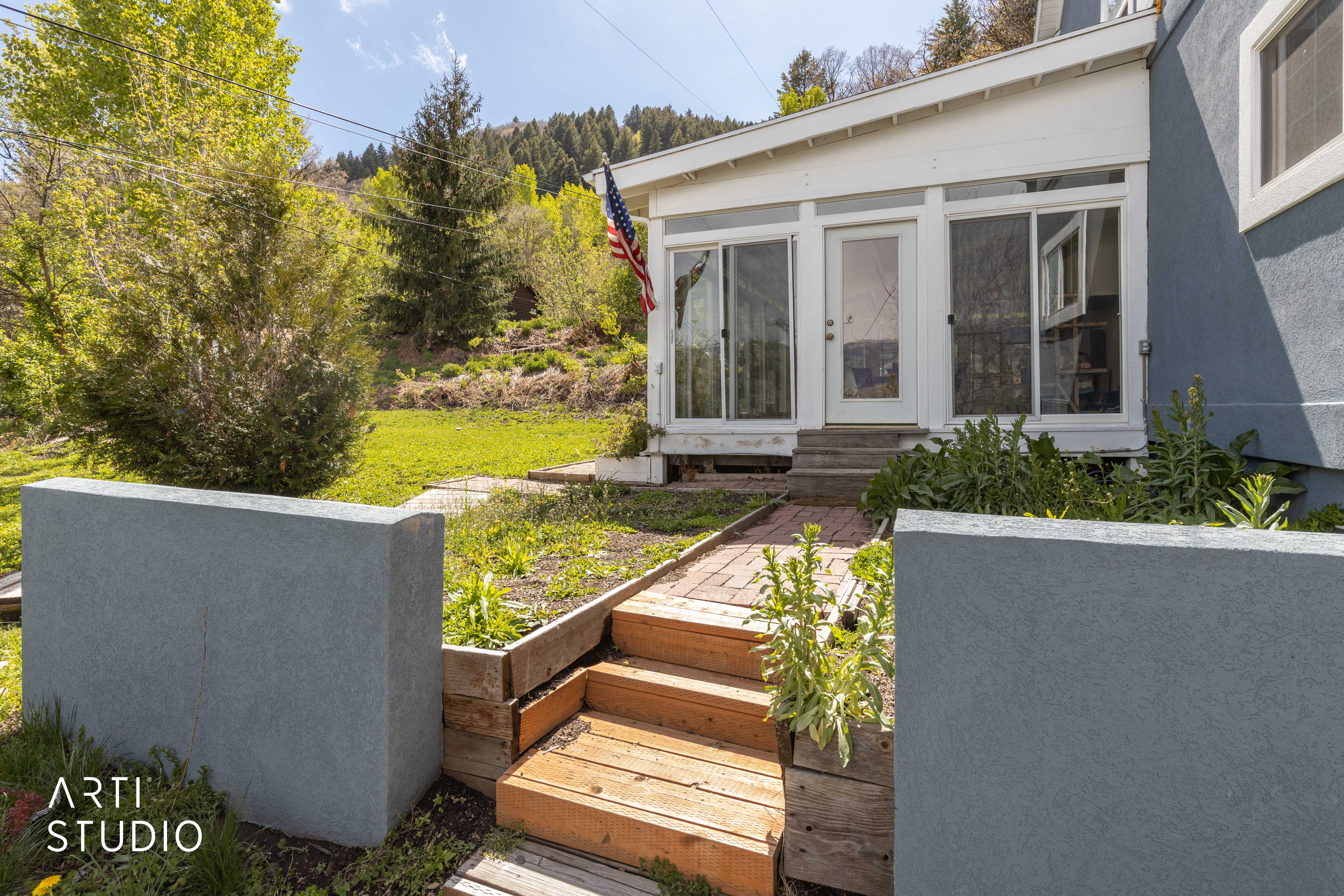 View of yard with entry steps