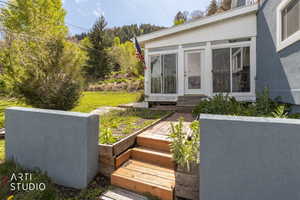 View of yard with entry steps