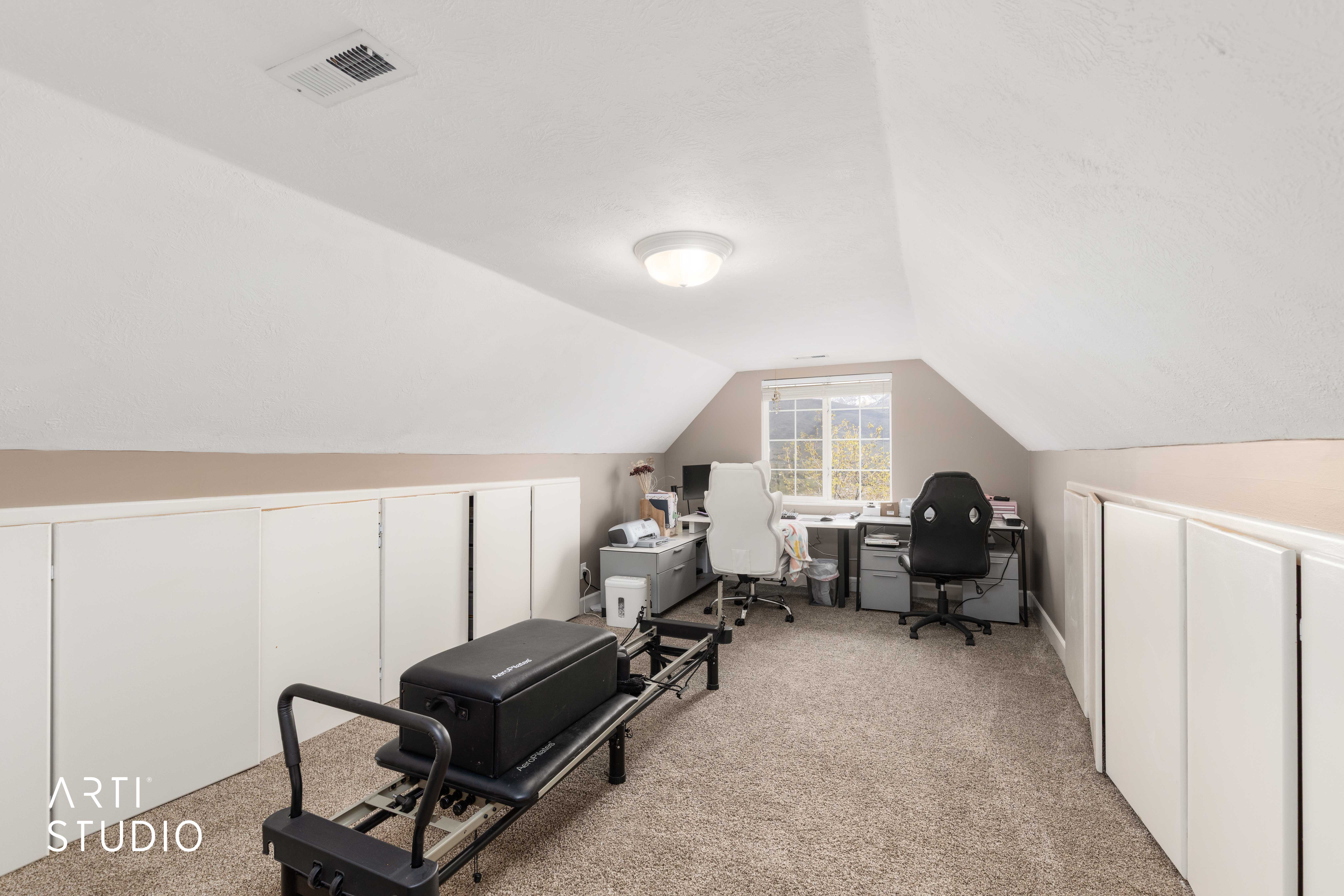 Office space featuring light carpet