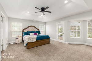 Bedroom featuring access to outside, a tray ceiling, light colored carpet, ceiling fan, and recessed lighting