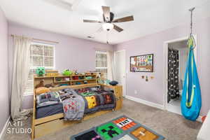 Bedroom featuring light carpet and a ceiling fan