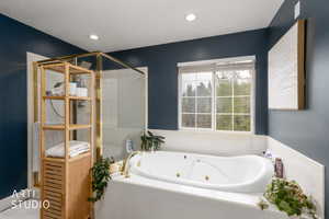 Bathroom featuring a jetted tub and recessed lighting