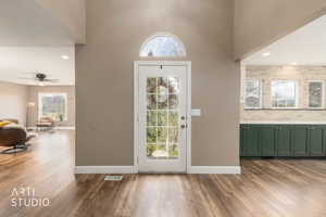 Entryway featuring recessed lighting, dark wood finished floors, a high ceiling, and a ceiling fan