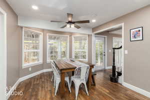 Dining space featuring a ceiling fan, dark wood-style floors, and recessed lighting