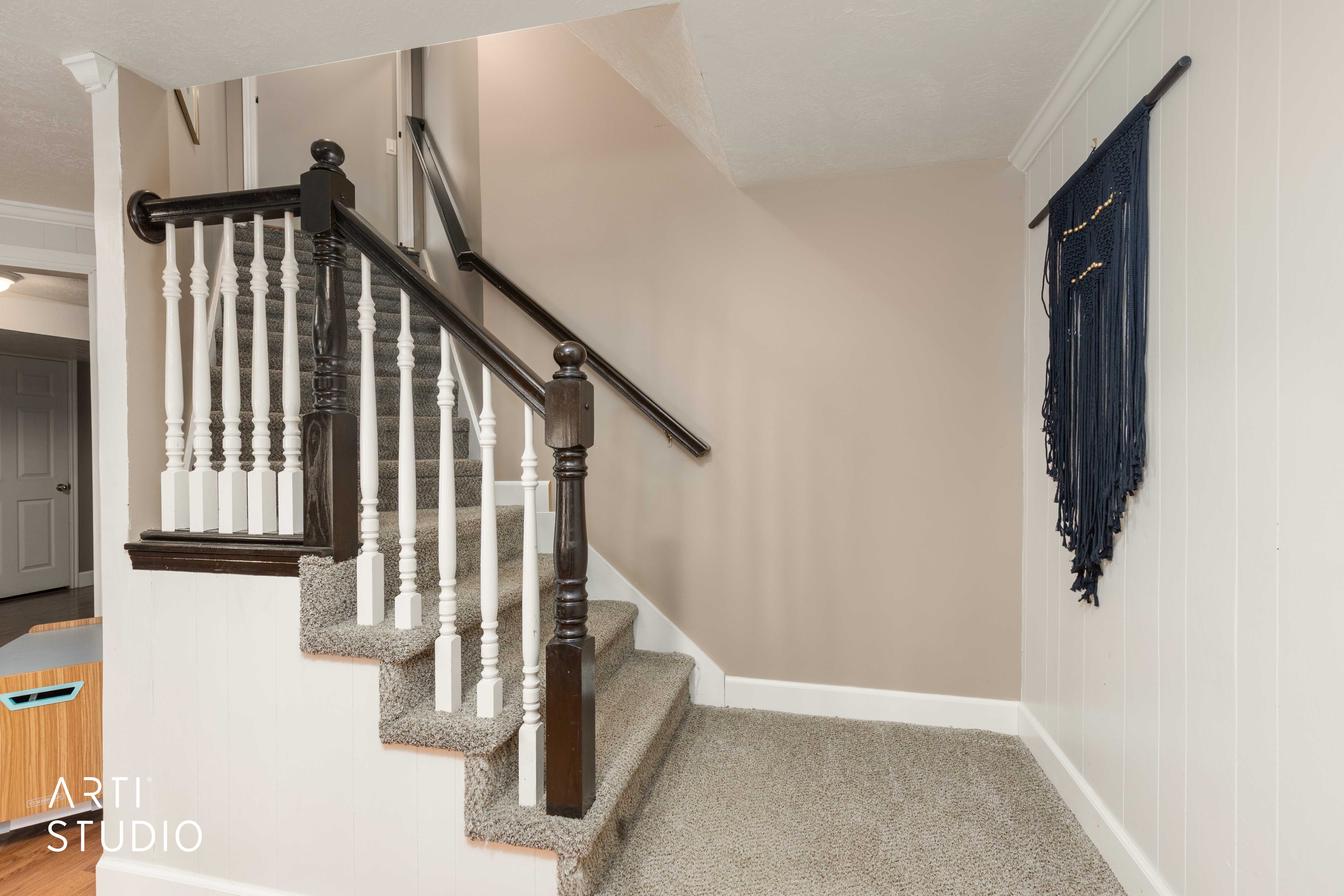 Stairs featuring carpet and crown molding