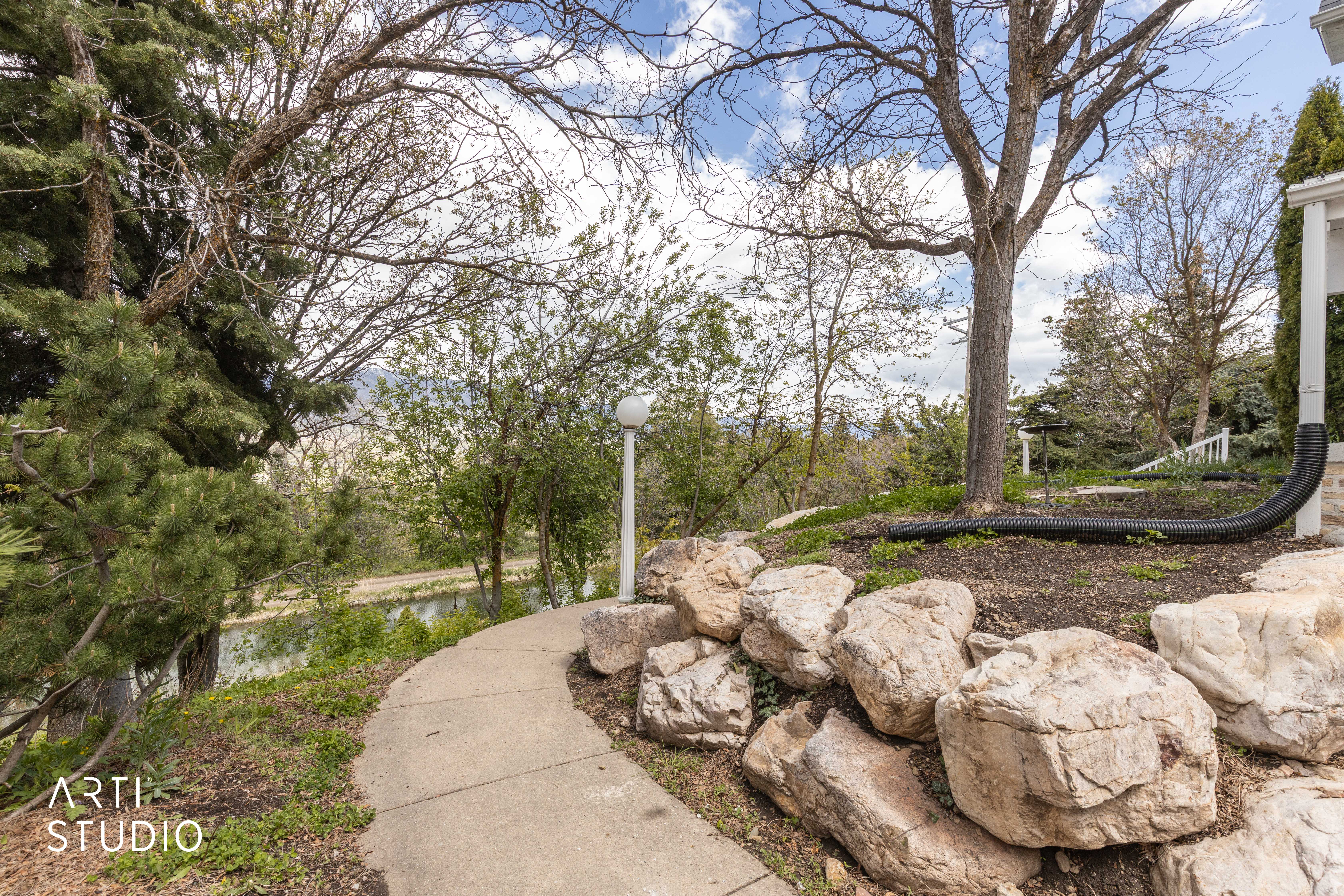 View of yard with a water view