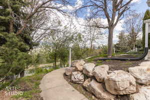 View of yard with a water view