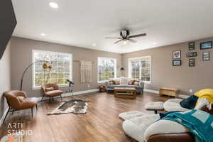 Living area featuring a ceiling fan, wood-type flooring, and recessed lighting