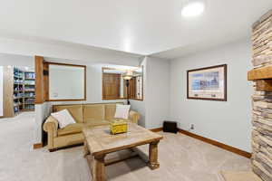 Living room with carpet and baseboards