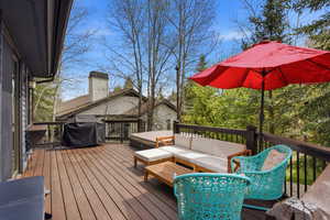 Deck with a grill and outdoor seating