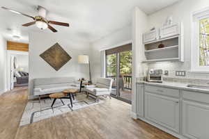 Mother in Law that can or can be a great office space or just additional living space. Kitchen featuring stainless steel appliances, ceiling fan, bedroom, bathroom and private entrance.