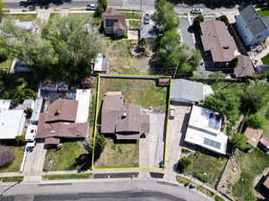 Aerial perspective of suburban area featuring property boundaries highlighted