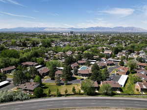 Aerial view of residential area featuring a mountain backdrop