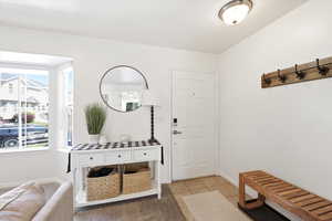 Entrance foyer featuring light tile patterned flooring and baseboards