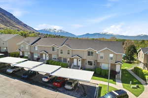 View of mountain backdrop featuring nearby suburban area