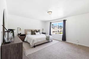Carpeted bedroom with baseboards