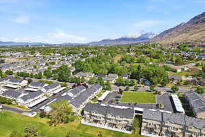 Aerial perspective of suburban area with a mountain backdrop
