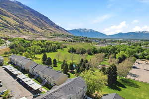 Aerial perspective of suburban area featuring a mountainous background
