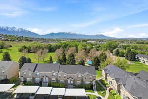 Aerial perspective of suburban area with a mountain backdrop