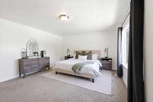 Carpeted bedroom with baseboards