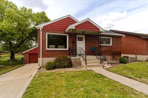 View of front of property with brick siding
