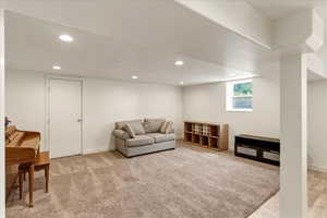 Sitting room featuring recessed lighting and light colored carpet
